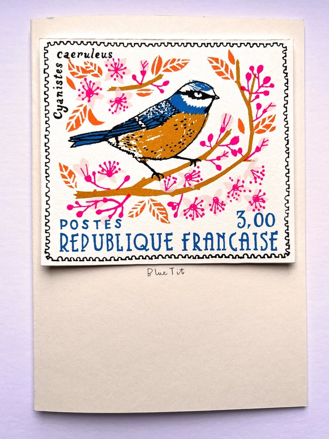 Bird Stamp Card Blue Tit/ French Stamp Card, a white card with a colourful bird design in the centre against a purple background. 