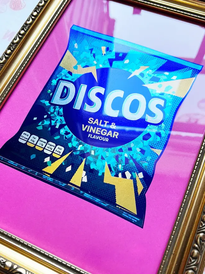 'Disco Salt & Vinegar Flavour' ScreenPrint, a colourful discos print sitting in a gold frame held by a person. 