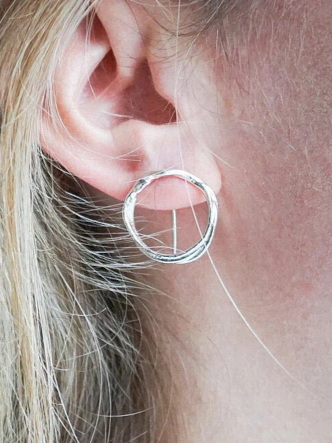 A woman wearing Silver Organic Circle Threader Earrings