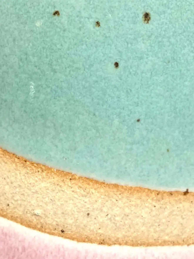 Detailed close up of flecks and texture in the glaze and clay of a Shoreline vase