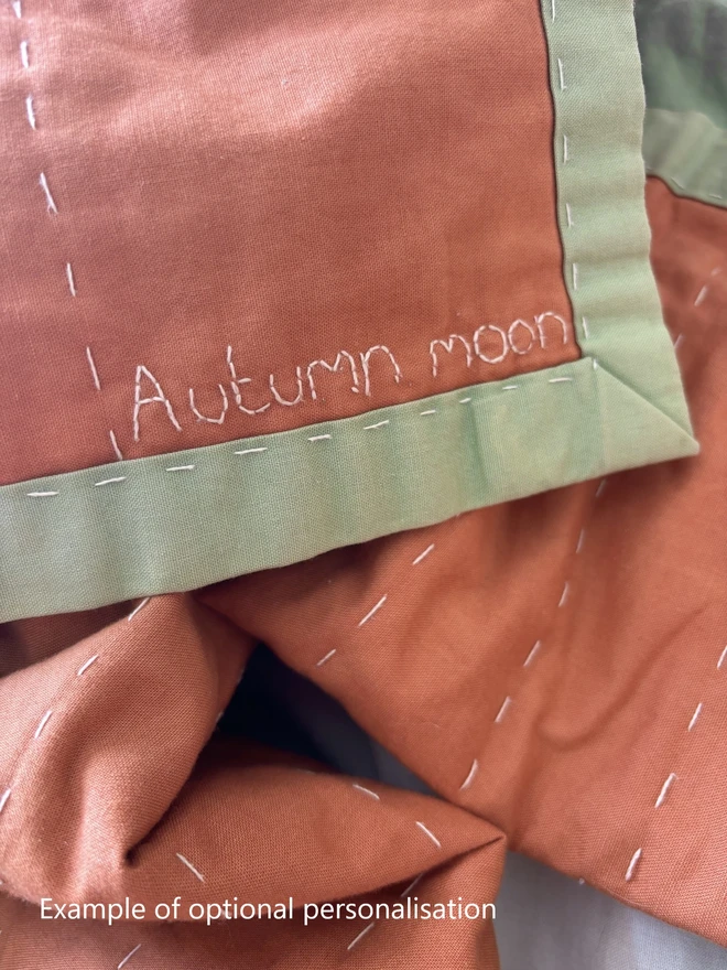 Embroidered personalisation option of name, date message to personalise quilt