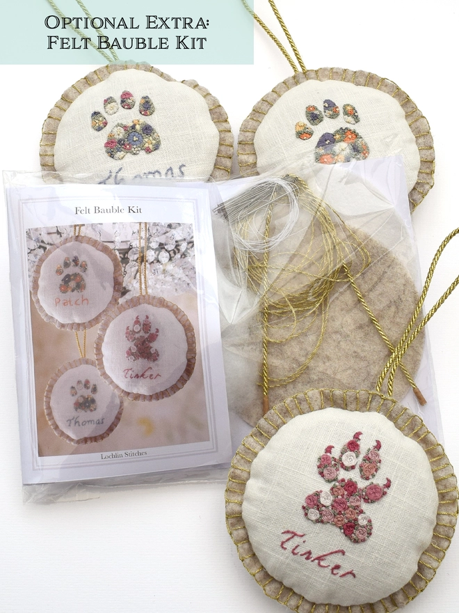 The Felt Bauble kit shown alongside a few finished embroidered felt baubles.