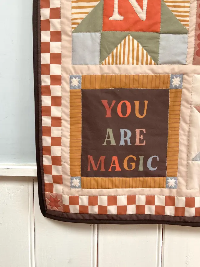 personalised baby quilted wall hanging. a patchwork hanging quilt decoration to commemorate a baby's birth.