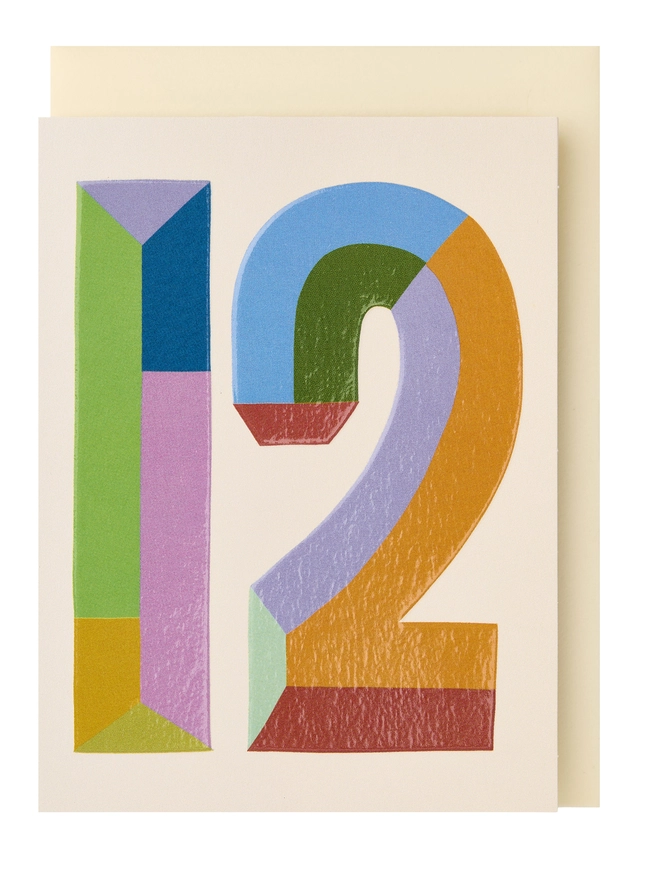 Colourful mini greeting card featuring a colour block 12 in the centre of a cream background