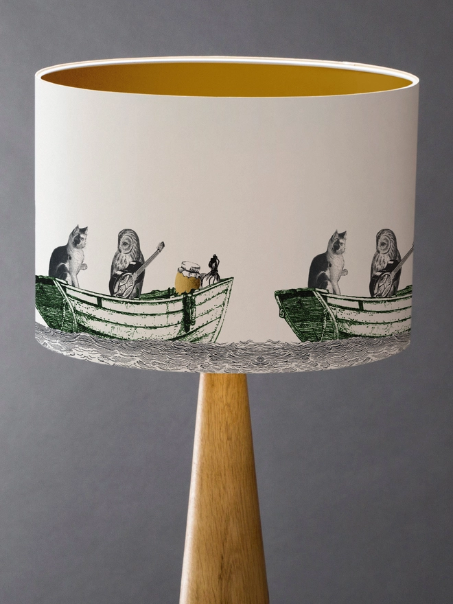 Handcrafted Owl and the Pussycat lampshade featuring a whimsical pea green boat illustration, bringing a touch of nostalgic storybook charm to the home.