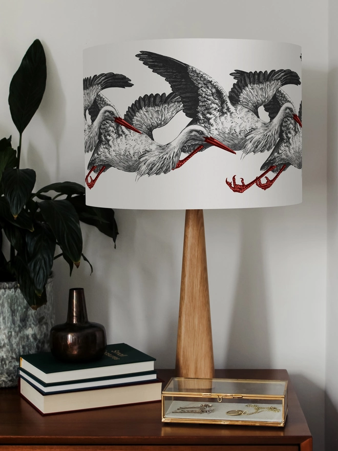 Elegant lampshade featuring elegant storks on a stylish, playful design.