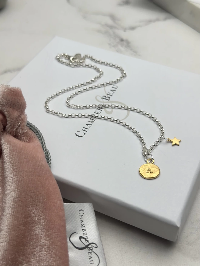 sterling silver chain with personalised gold circular charm and mini gold star