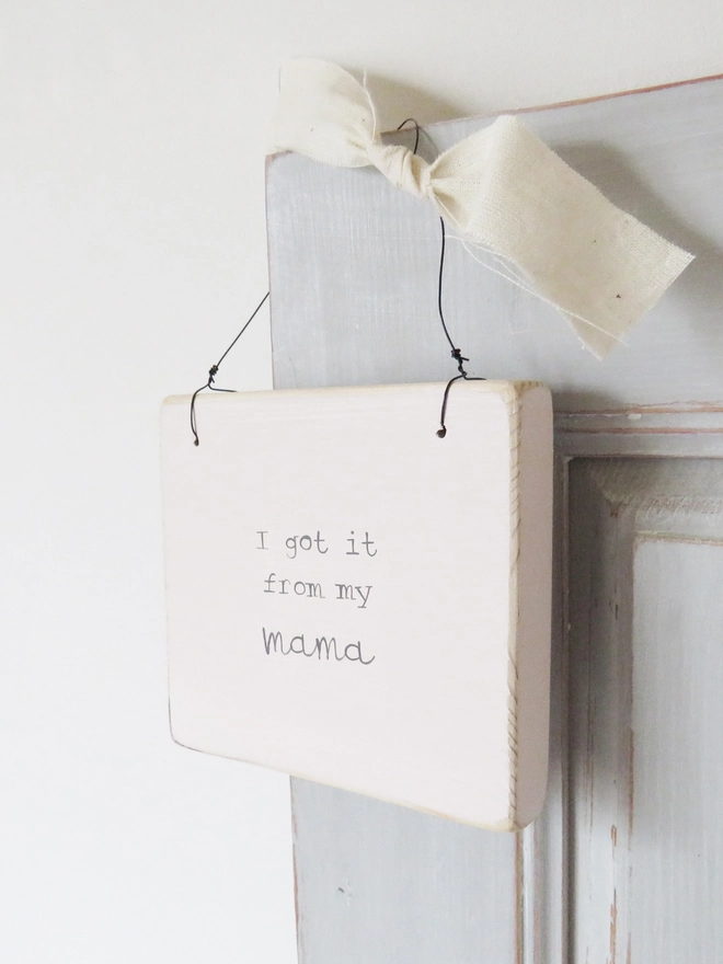 soft pink wooden hanging sign