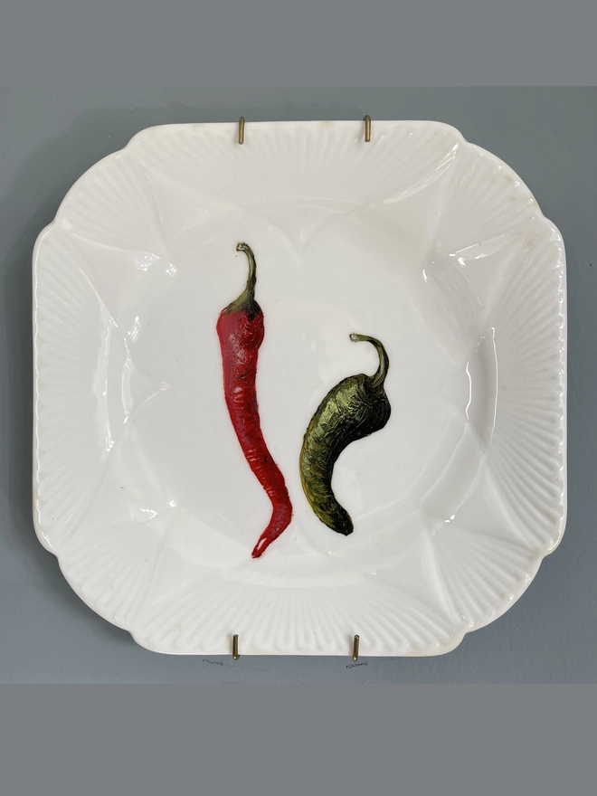 2 chillies painted on 1920s plate