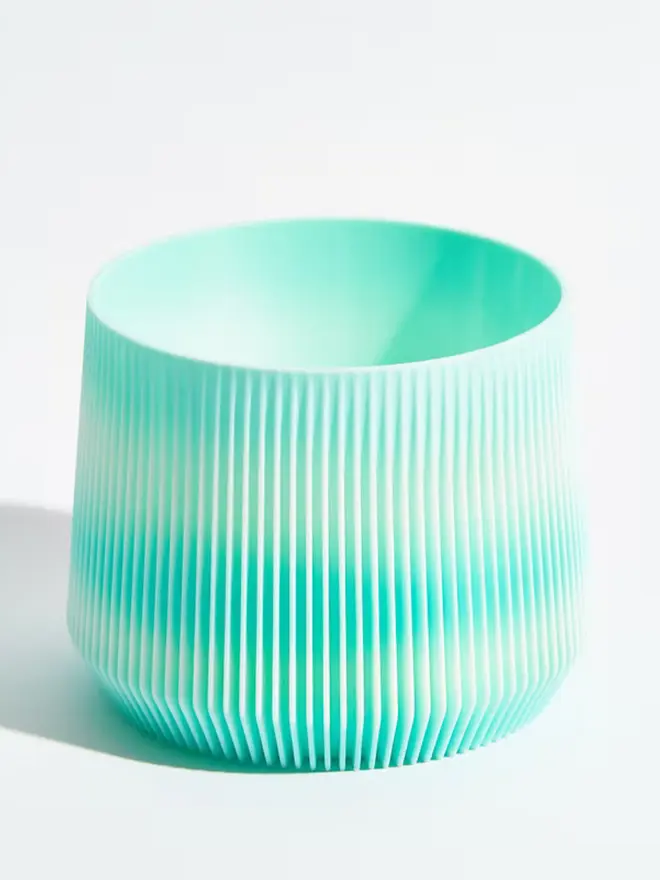 Sustainable 3D Printed Sky Blue Plant Pot, pillar design, against a white background.