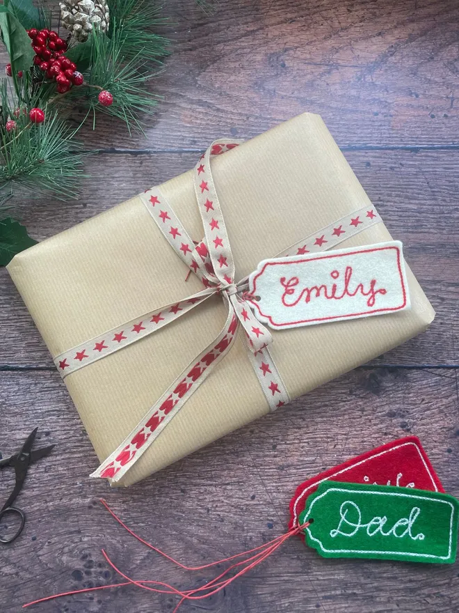 Embroidered christmas gift tag on a wrapped up present