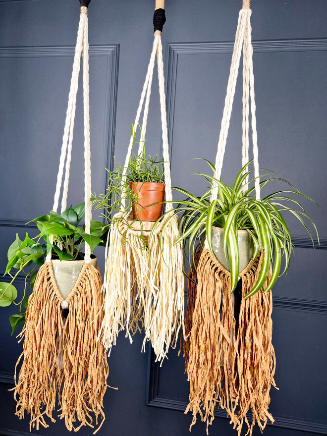 Handmade unique macrame raffia plant hanger, adding natural texture to your home or empty space, perfect for showcasing indoor plants and enhancing your decor