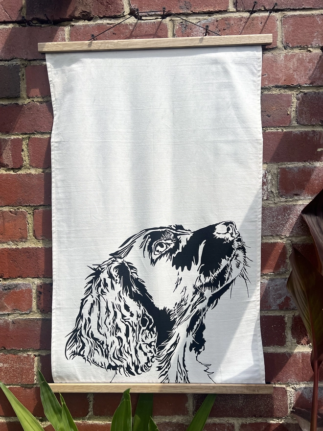 Springer dog tea towel illustrated with the side profile of a springers head
