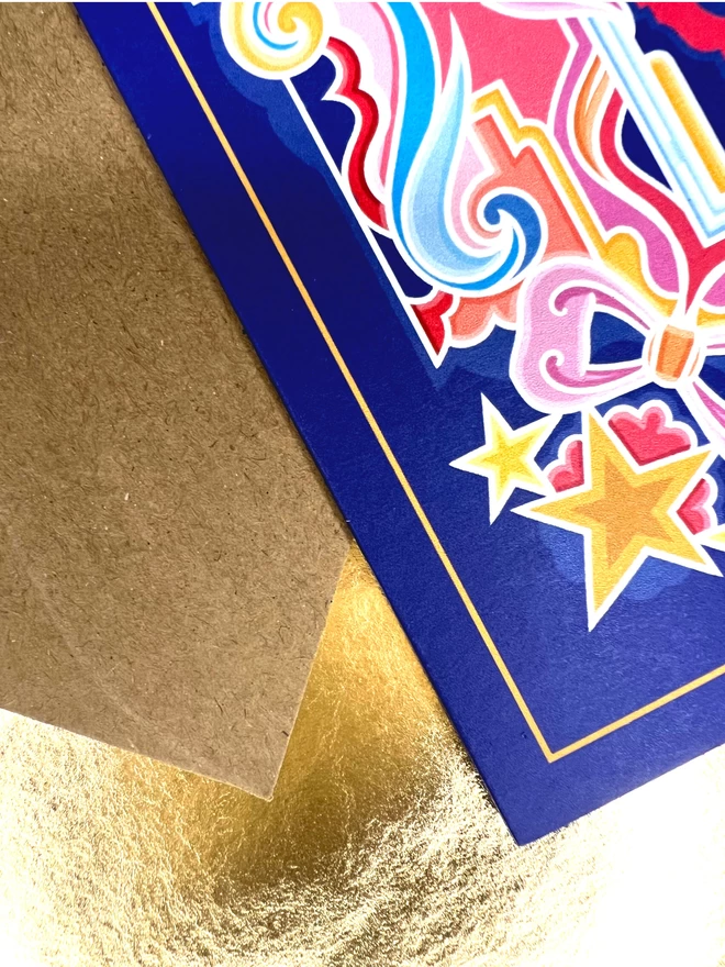 Close up on the corner details, showing the blue background, thin yellow inner border, gold stars and vibrantly coloured patterns.