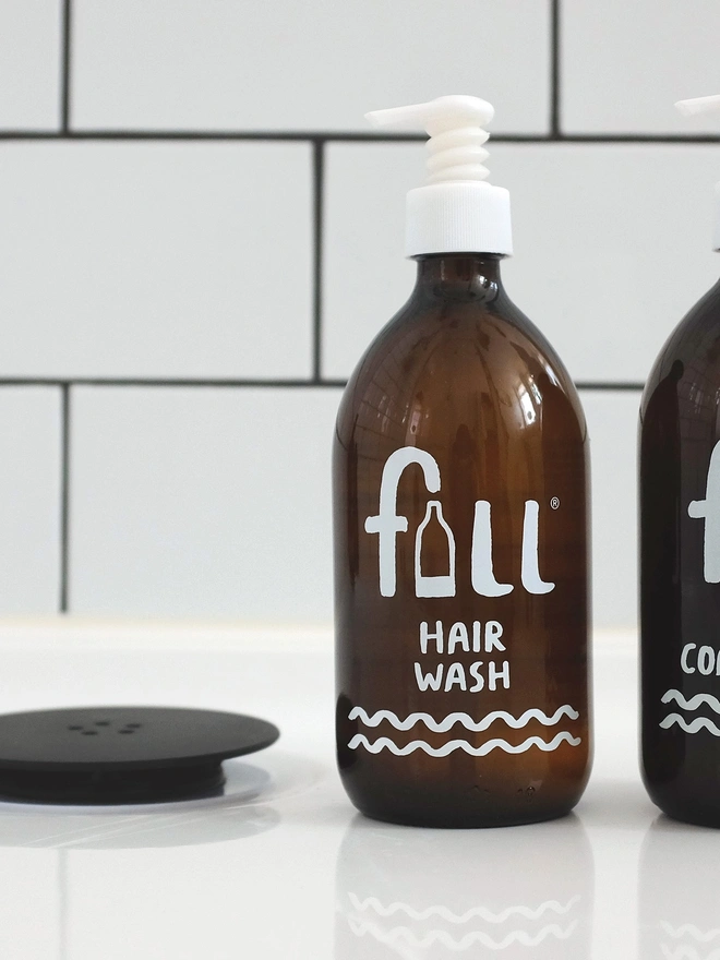 dark amber glass bottle of hair wash