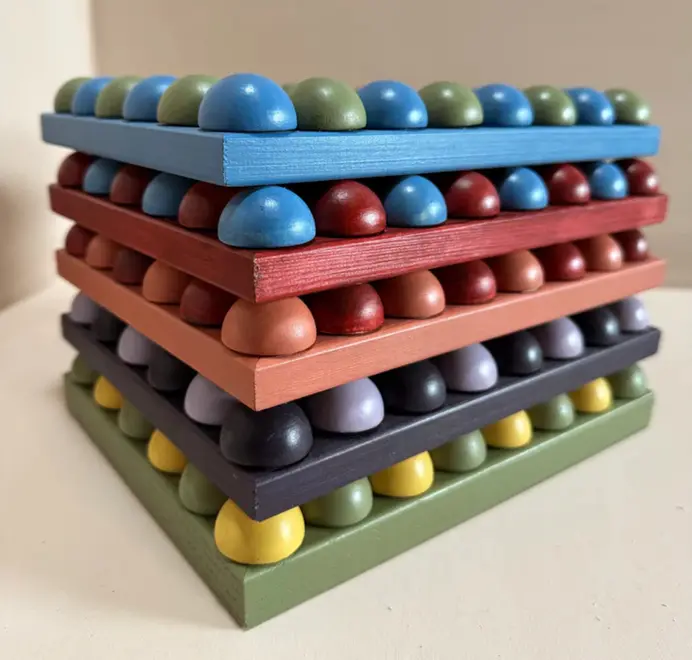 stack of multicoloured bobbin frames
