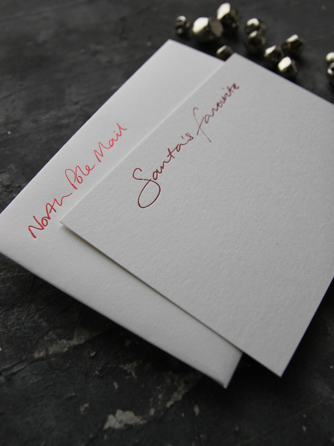 christmas notecard hand foiled in red, says Santa's Favourite, envelope with North Pole Mail hand foiled on it