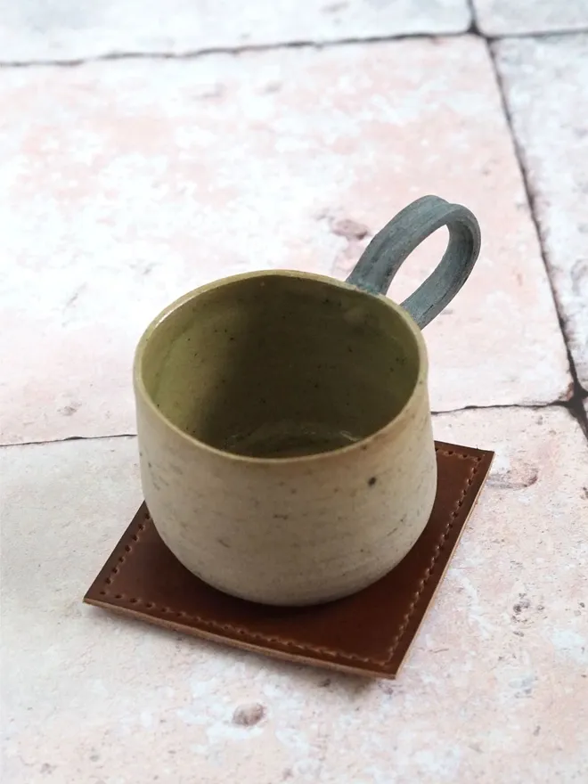 leather coaster with large mug