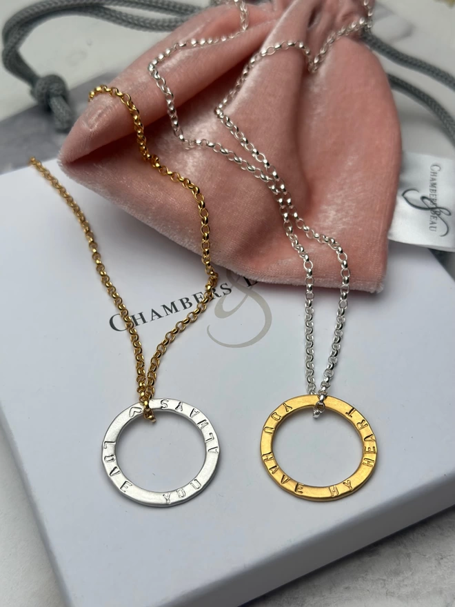 personalised gold plate circle charm on sterling silver chain, and a personalised sterling silver halo charm on gold plate chain