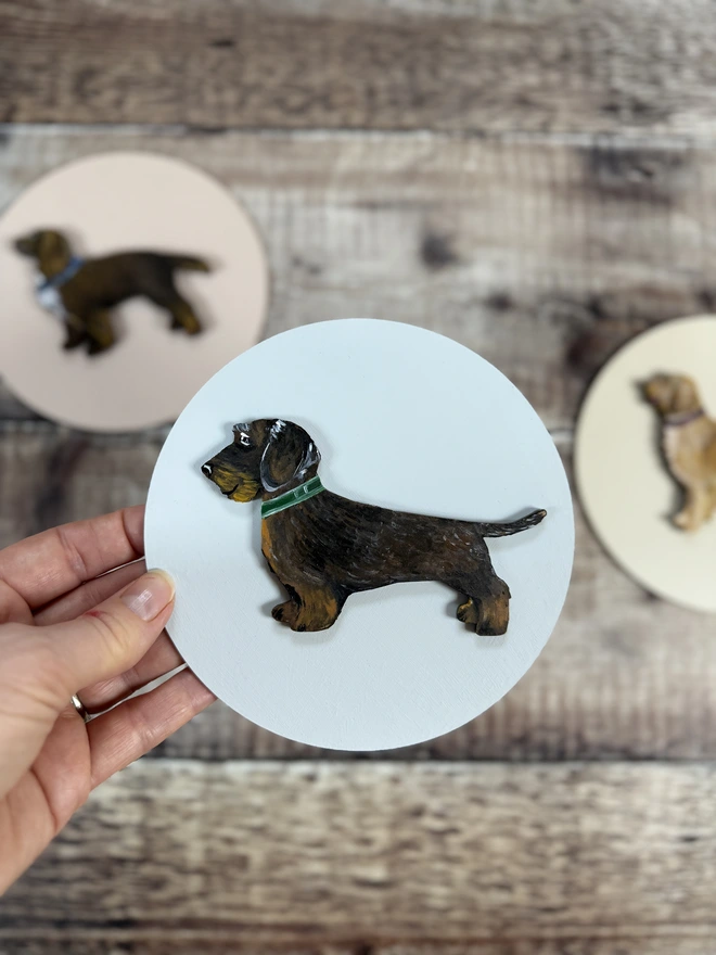 Wire Haired Dachshund painting on blue circular painted background