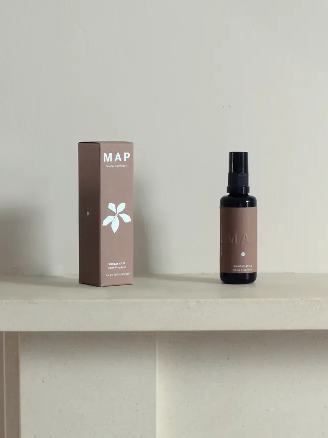 sunday at 12 sandalwood and rose home fragrance spray. spray bottle and packaging box photographed on shelf.
