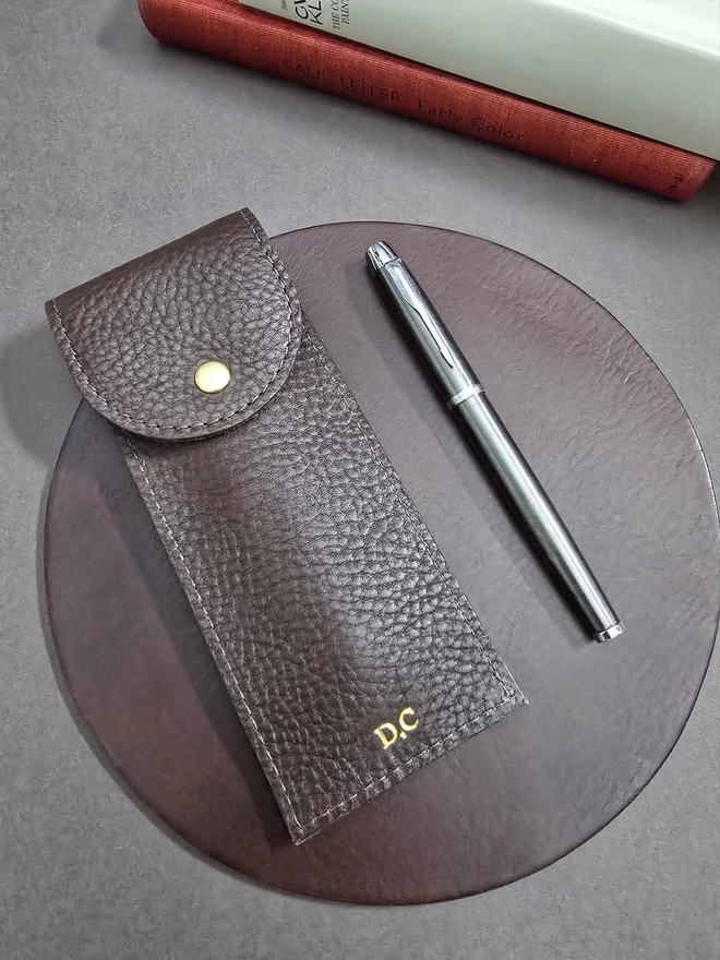 a brown leather pen case holder lined with a rare escape map by natthakur