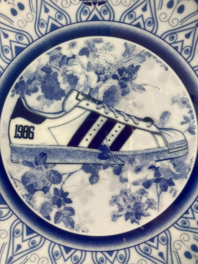 Detail of plate showing a close up of the Superstar trainer in profile