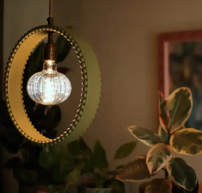 ring shaped pendant lamp in green with bobbin rim