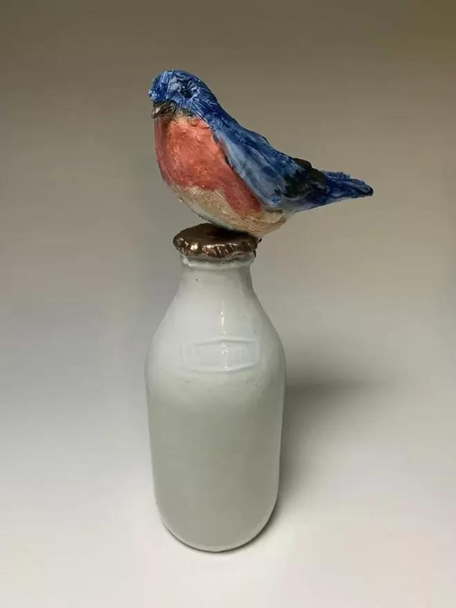 Bluebird on a milk bottle