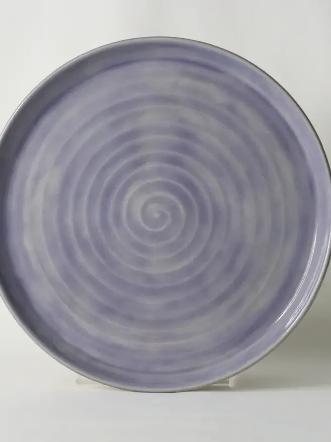 purple ceramic plate with textured swirl design
