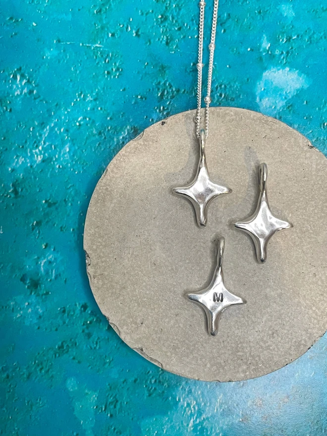 Hand made star charms made from 100% recycled sterling silver, cute gift for girlfriend or wife for Valentine's Day or Mother's Day. Add a personalised initial and send straight to your special someone. Made by Celina C Jewellery, a small business in the UK, find on Holly and Co.