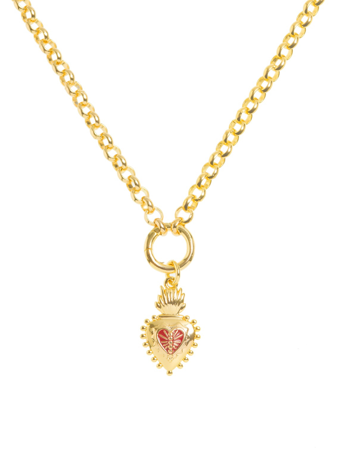 Gold and red enamel frida kahlo charm hanging from a gold belcher chain necklace against a white background