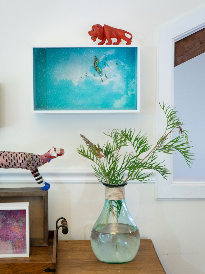  A Glass Cathedral artbox displayed in a home interior setting with other decorative objects 