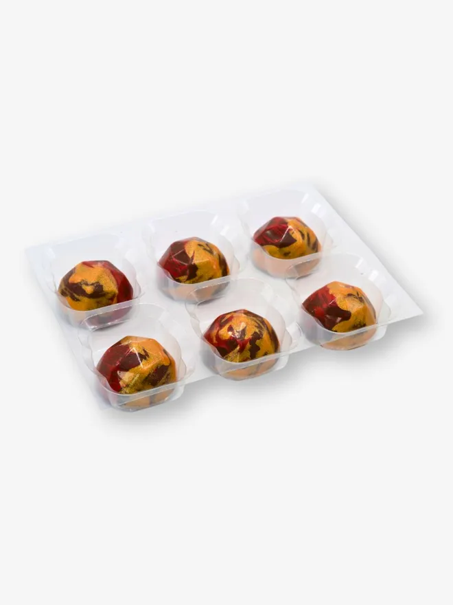 A tray of 6 luxury raspberry and rose milk chocolates