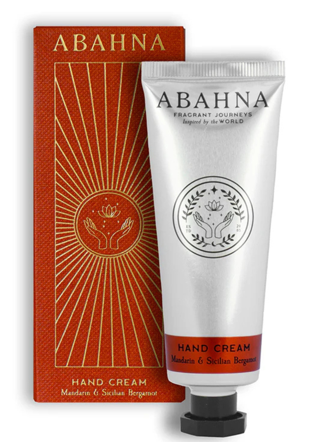 mandarin and sicilian bergamot botanical hand cream. an orange box and silver tube containing hand lotion.