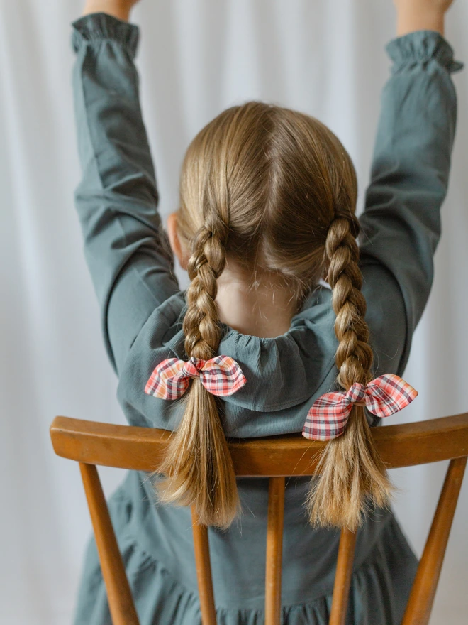 Girl with plaits and check hair bobbles