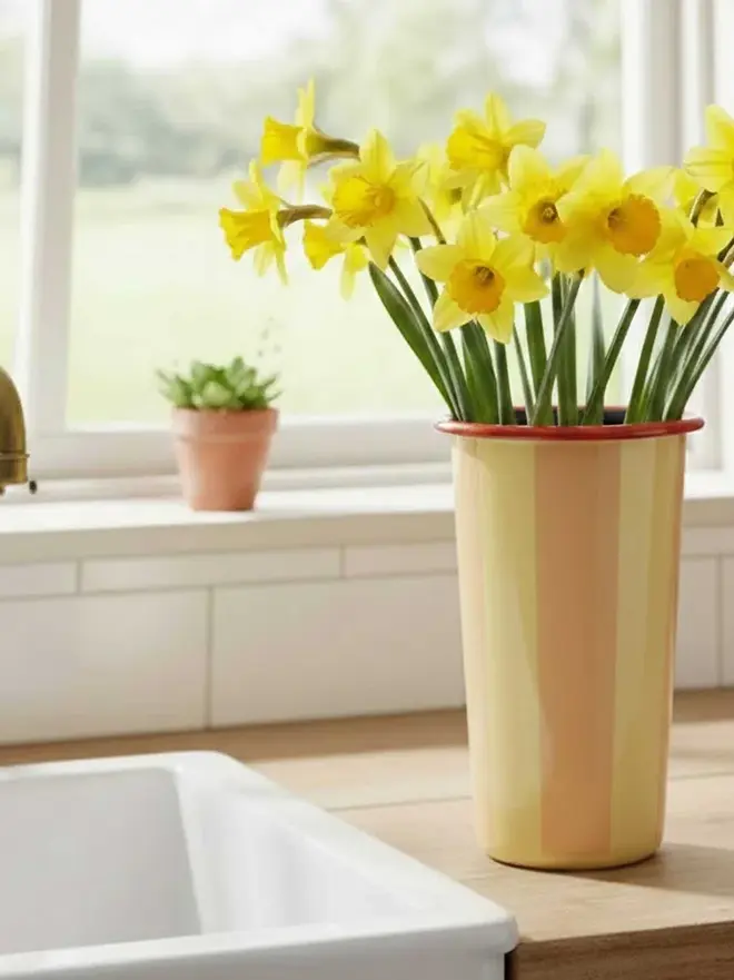 Enamel Vase, a colourful enamel vase sitting on a wooden surface. 