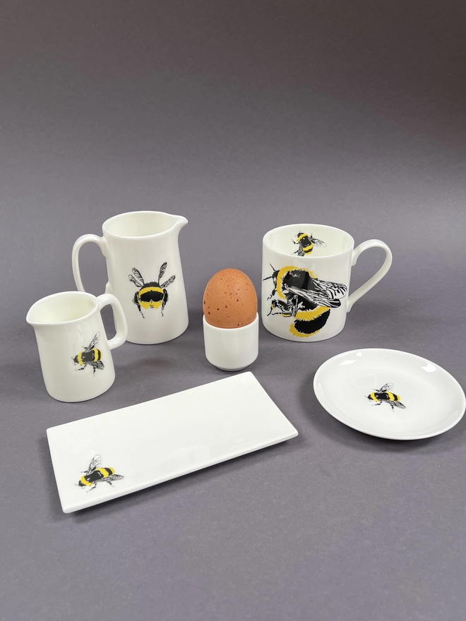 Bumble bee complementary products including round and rectangle trinket trays, quarter and half pint jugs, egg cup and mug that are great for house warming,wedding and anniversary gifts