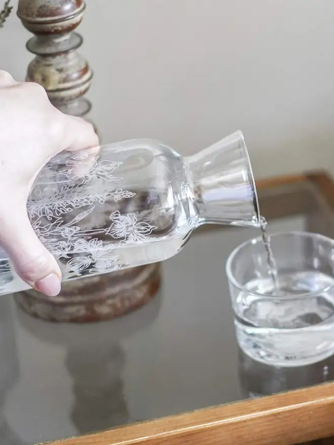 Floral Mini Carafe & Glass Set, on a clear table. 