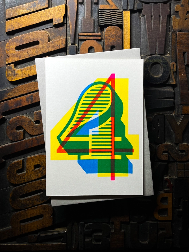 4th birthday anniversary milestone typographic letterpress card with deep impression print. Very colourful and vibrant. They show slight colour variations adding to the style anding to the charm of this handmade greeting card.