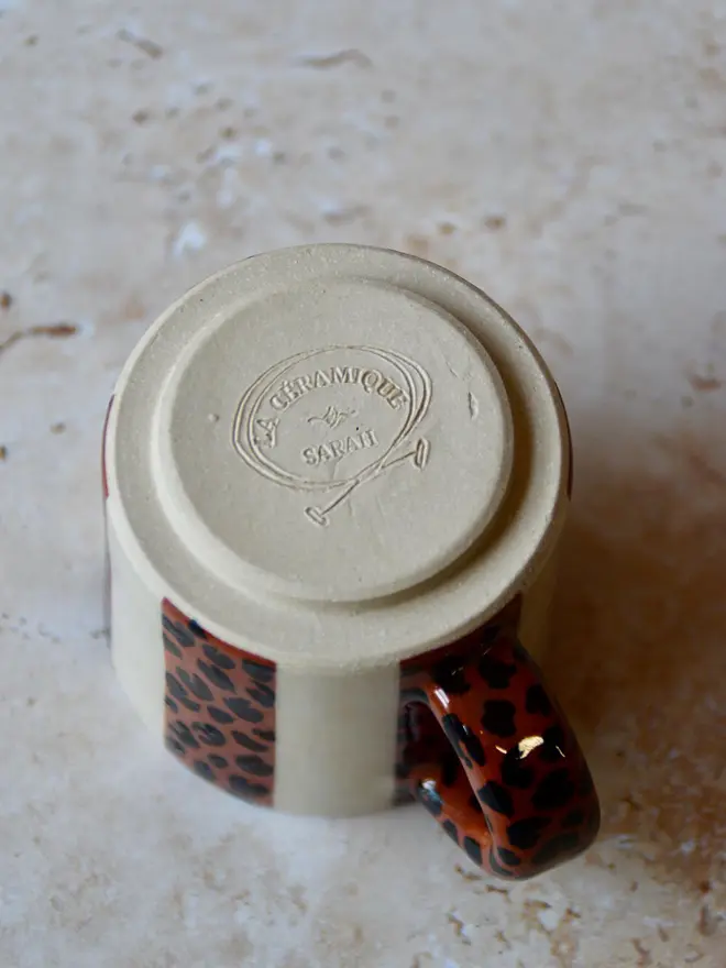 Le Petit Rayé handmade espresso cup base showing maker’s mark - leopard pattern handle