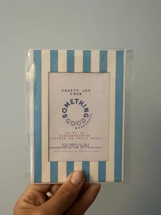 Thin Striped Screen Printed A6 / A5 / A4 Photo Mount. blue striped mount shown against grey background.