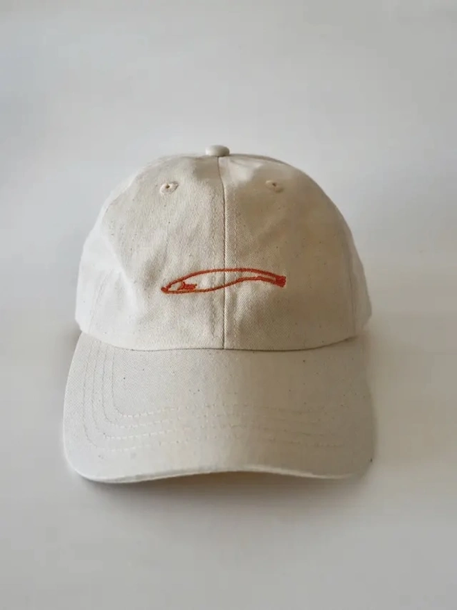 Omiyage Collection, a hat sitting on a white surface. 