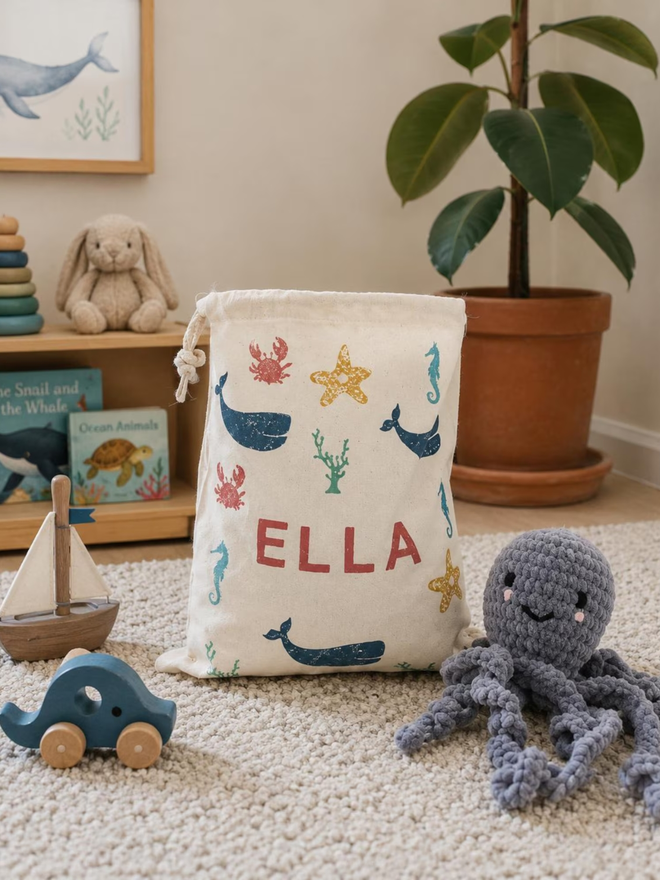 personalised toy sack. a drawstring bag with printed sea creatures and a personalised name.