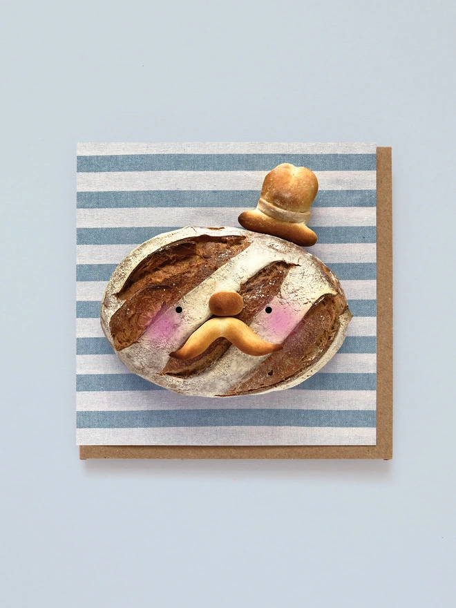 A lovely Baked loaf man with a hat on 