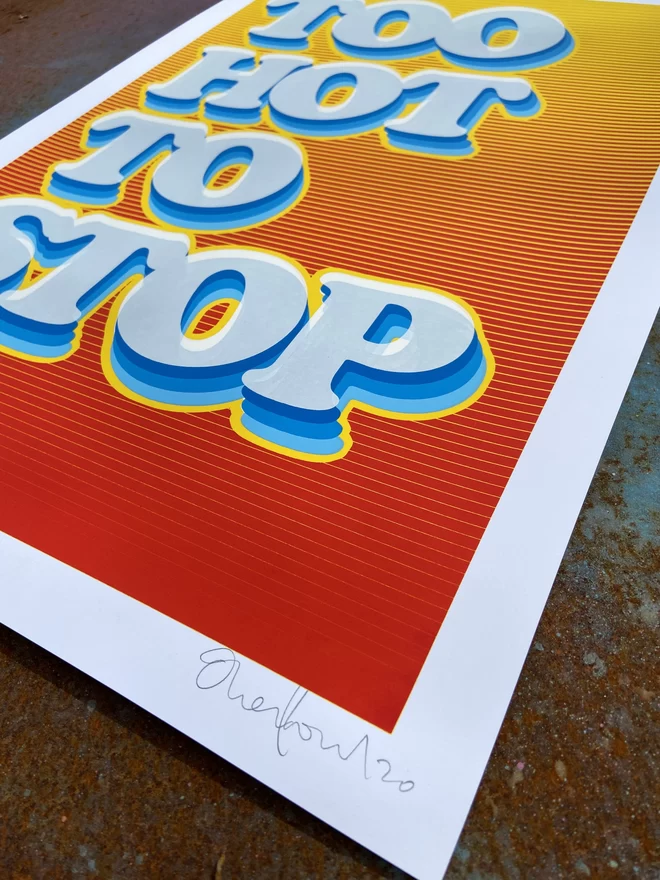 "Too Hot To Stop" Hand Pulled Screen Print with yellow and red blended background and the words too hot to stop printed on top in a fading blue rainbow motion 