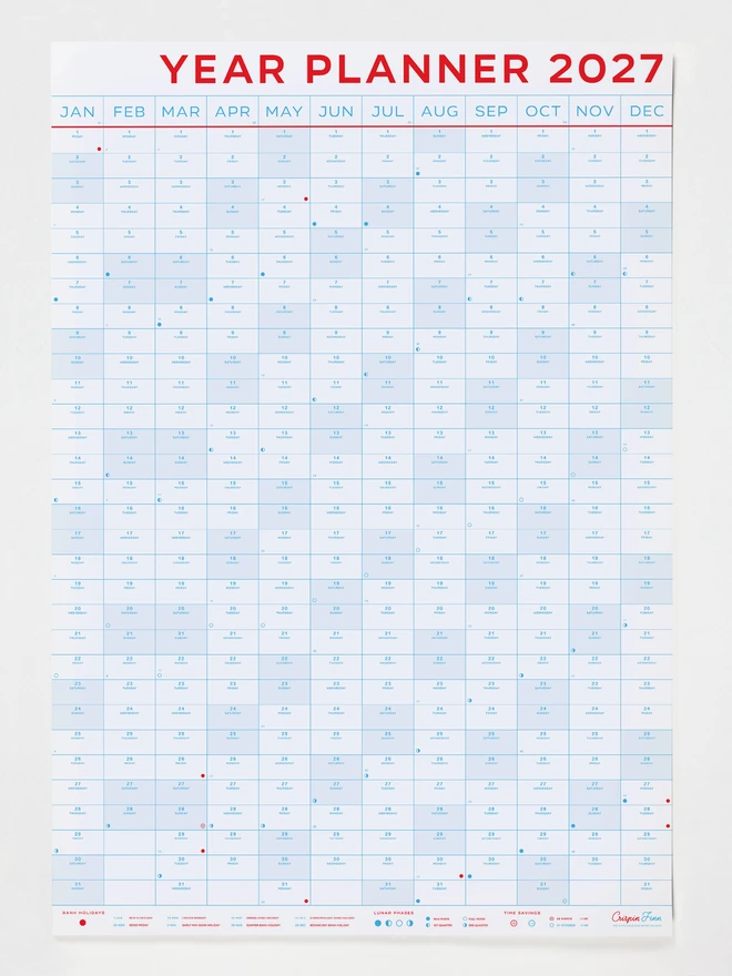 Crispin Finn 2027 Year Planner in large portrait format hanging on a studio wall showing week numbers, bank holidays, and lunar calendar icons.