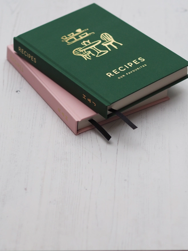 personalised hardcover notebook saying "recipes" "our favourites" in gold foil and with personalised text down the spine