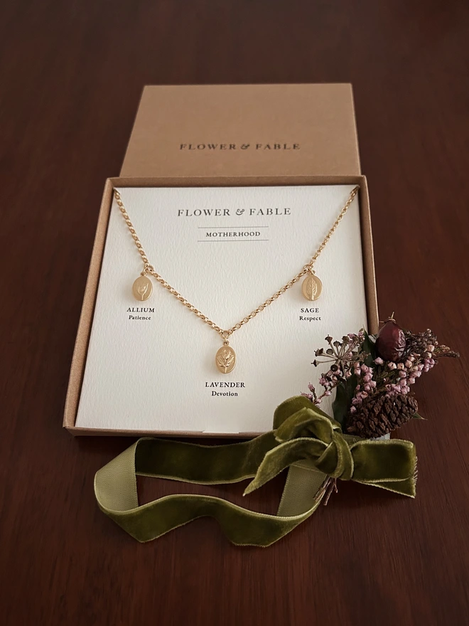 Daughterhood Triple Charm Necklace with presentation box and Christmas posy