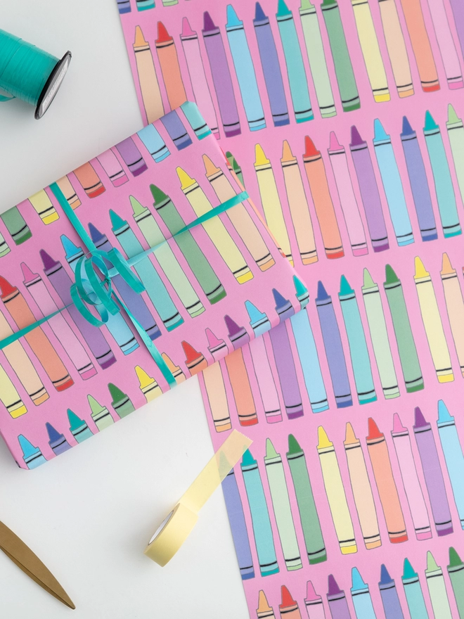 Colourful children's wrapping paper featuring crayon design